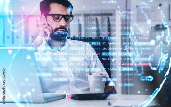 Fototapeta Businessman in shirt is talking on smartphone and drinking coffe