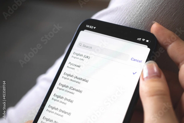 Obraz Setting the language on the new mobile phone, settings screen close-up photo