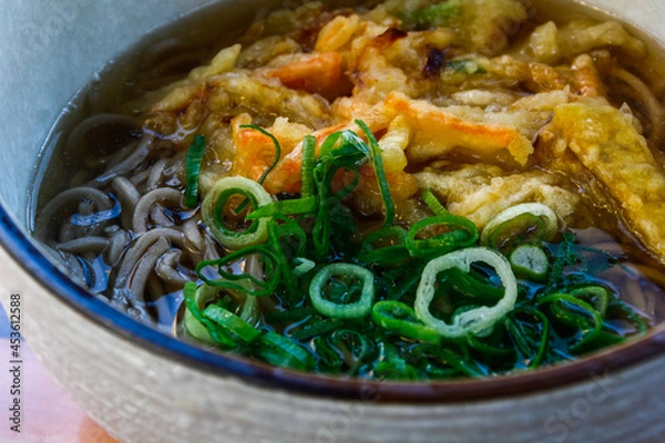 Fototapeta Bowl of vegan soba noodles with spring onion and vegetable tempura, in Kyoto, Japan
