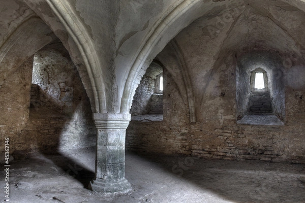 Obraz Ancient dungeon dark stone basement with gray sand floor