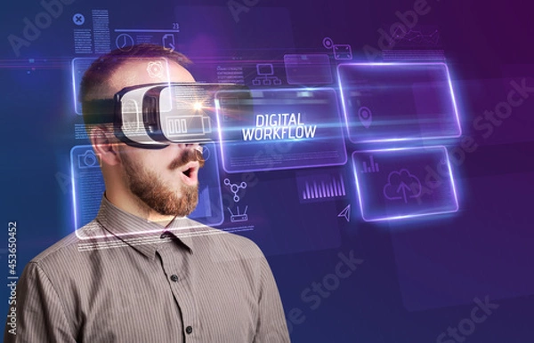 Fototapeta Businessman looking through Virtual Reality glasses, tech concept