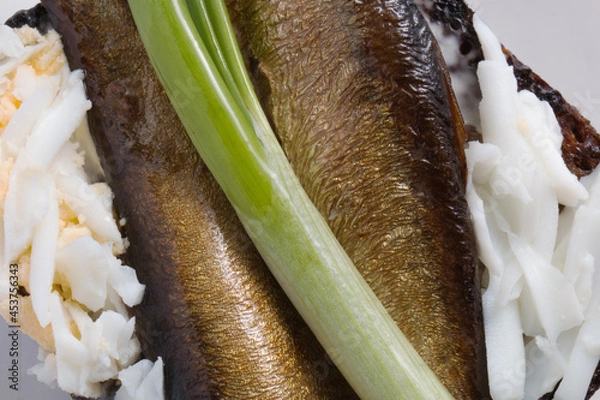Fototapeta Sandwich with sprats, egg and green onion