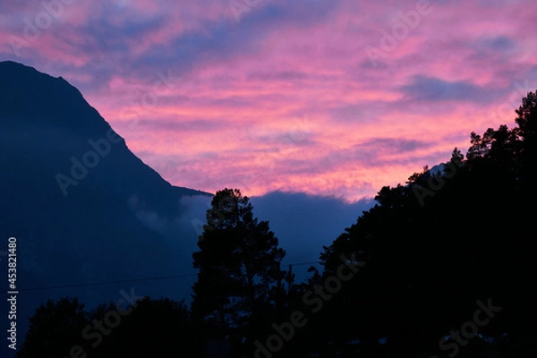 Fototapeta sunset over the mountains