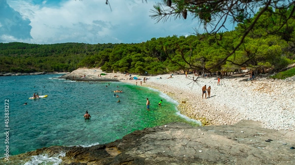 Fototapeta Vis Croatia, July 2021 Srebrna beach on the island of vis, directly translated meaning Silver Beach. Summer of 2021, tourists traveling during covid times to warm croatia