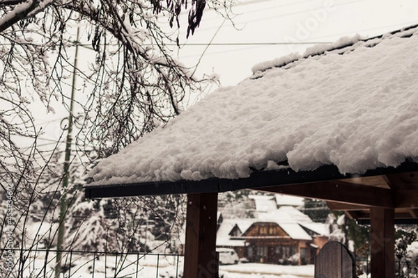 Obraz roof of a house with snow winter concept