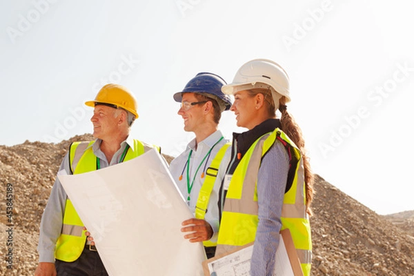 Fototapeta Business people and workers talking in quarry