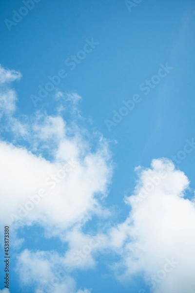 Obraz Beautiful white cloud with blue sky background.Bright blue sky background with tiny clouds.