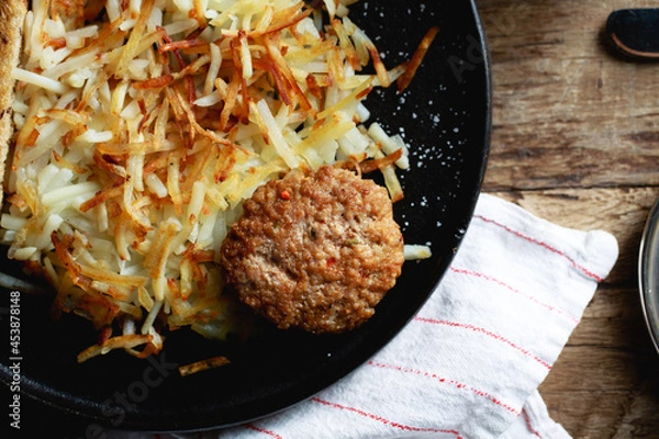 Obraz Breakfast sausage and hashbrowns
