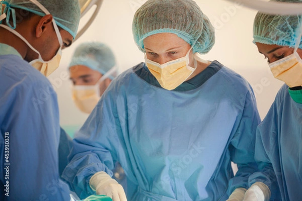 Fototapeta Surgeons working in operating room