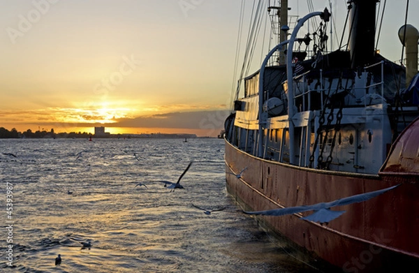 Obraz Boat moored at sunset