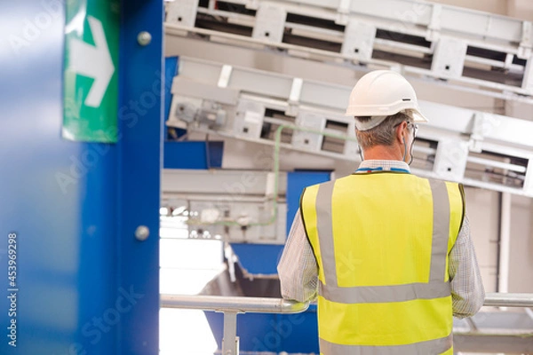 Obraz Worker on platform in recycling center