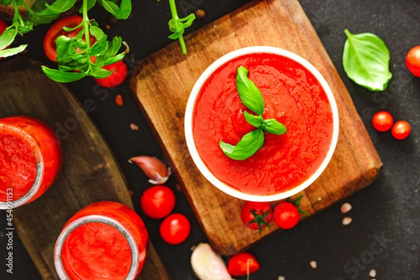 Obraz Tomato passata with basilium and garlic.