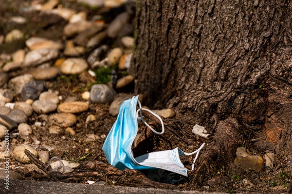 Obraz Surgical mask thrown on the floor