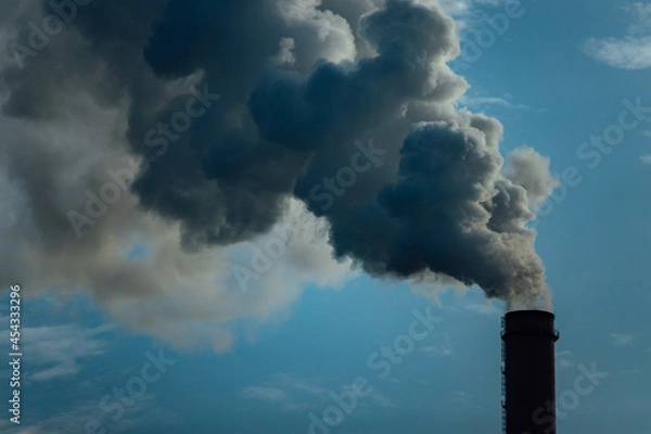 Fototapeta smoking chimneys of factories. pollution of the atmosphere by emissions and carbon dioxide. harmful emissions into the air. greenhouse gases from human activities