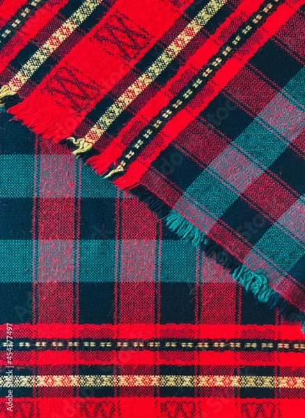 Obraz Traditional Bulgarian red cloth on the table at the restaurant. Balkan style fabric textile.
