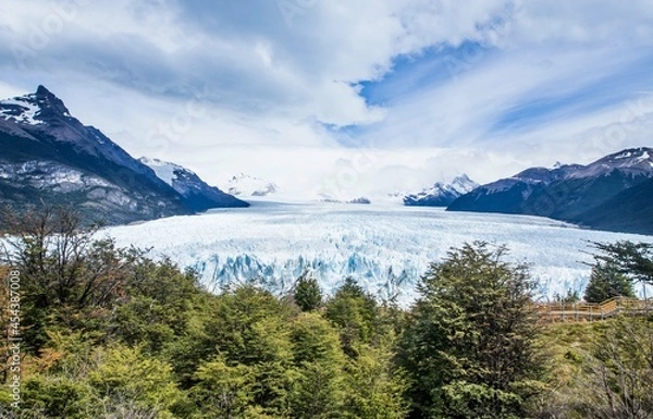 Fototapeta View of the Perito Moreno glacier with details of the iceberg and ice on a sunny day with clouds