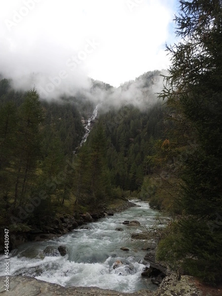 Fototapeta Mystic waterfall in Alps