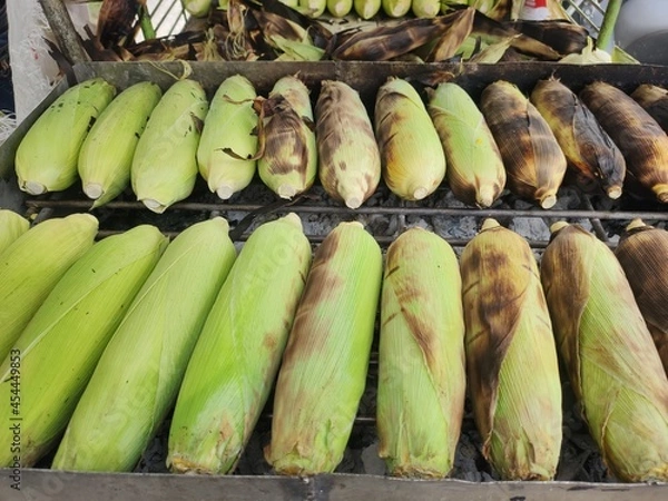 Obraz Grilled corn on a hot stove.