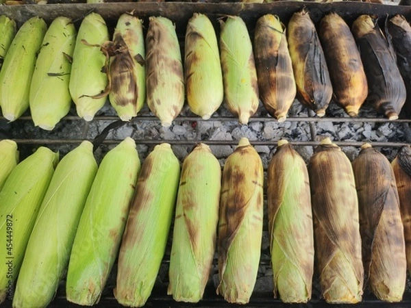 Obraz Grilled corn on a hot stove.