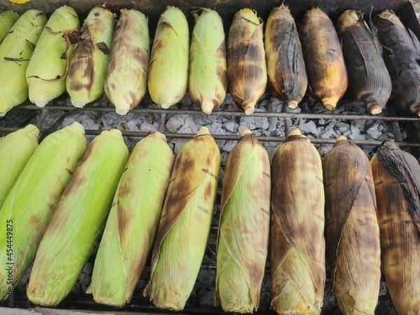 Obraz Grilled corn on a hot stove.