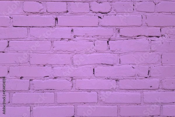 Fototapeta The texture of the wall made of purple bricks. Construction masonry.