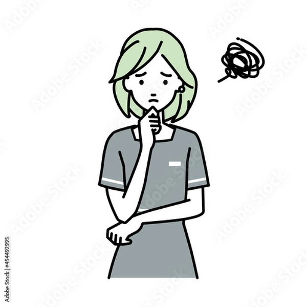 Fototapeta 立って手をあごにあてて困っているエステ店員の女性