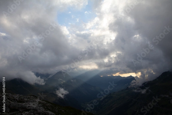 Fototapeta Amazing Landscape in the hearth of Switzerland. Epic scenery with the clouds and fog. Wonderful sunrays through the clouds and later an amazing sunset and sunrise. Perfect roadtrip through Switzerland