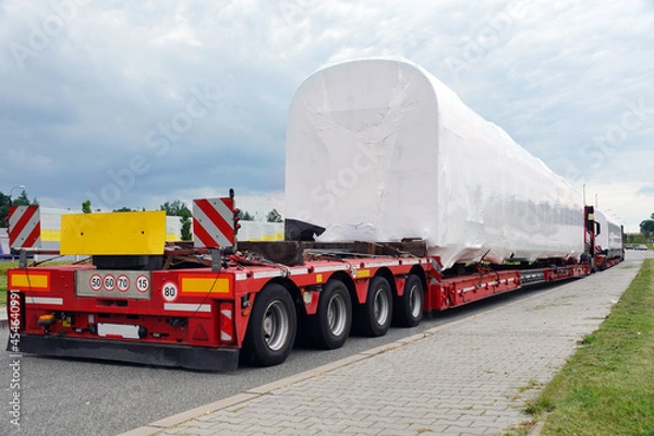 Fototapeta Very long vehicle. Oversize load or exceptional convoy. A truck with a special semi-trailer for transporting oversized loads.