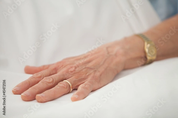 Fototapeta Hand of old woman with golden jewellery