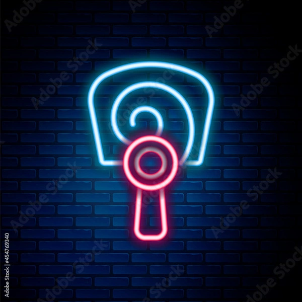 Fototapeta Glowing neon line Korean hand fan icon isolated on brick wall background. Colorful outline concept. Vector