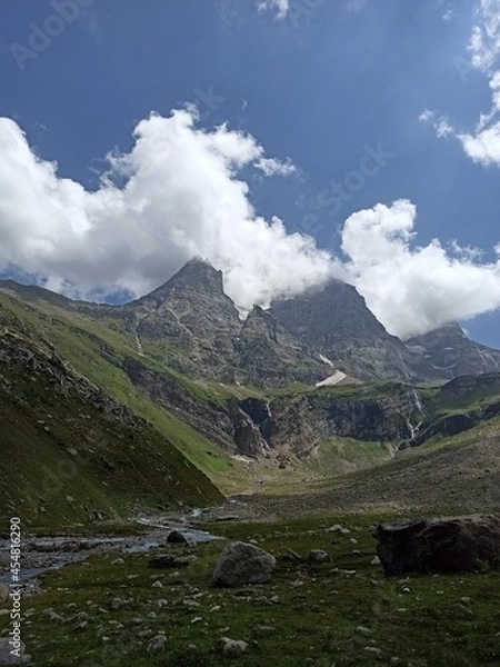 Obraz three big mountain cover with clouds