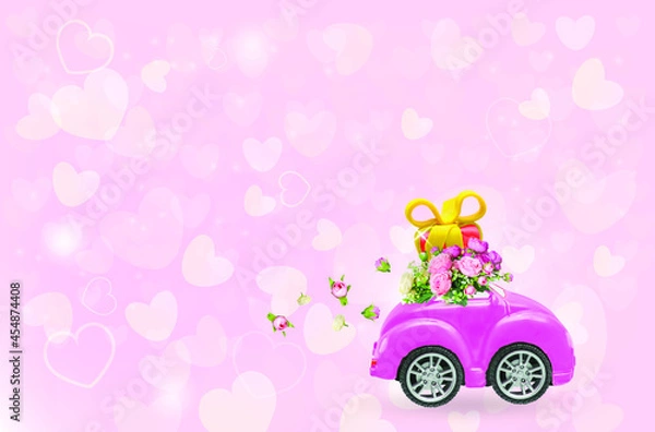 Fototapeta Pink retro car with gift box on a roof with flowers on pink background. Vector