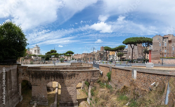 Fototapeta panoramic view at via dei Fori imperati with the antique rome with forum romanum and the archaelogical sites