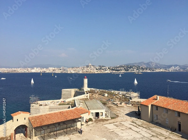 Fototapeta Panoramic view of Marseille and the Massif de Saint-Cyr (right) seen from the tower of Château d'If, a fortress and former prison located on the Île d'If, the smallest island in the Frioul archipelago