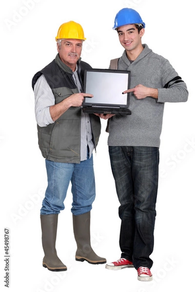 Obraz Builder and young helper pointing at laptop