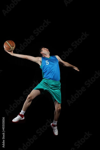 Fototapeta Basketball player with a ball