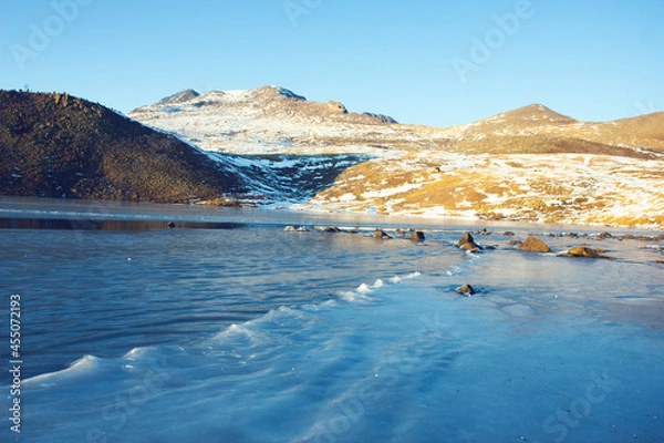 Fototapeta ice lake and hill in winter