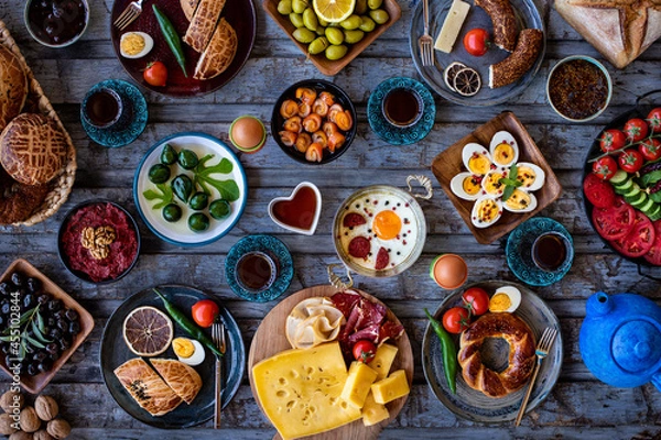 Fototapeta Breakfast table with many kinds of food