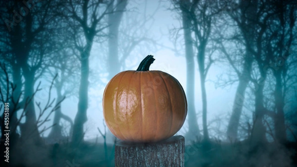 Fototapeta halloween pumpkin on a tree in a foggy and scary forest 