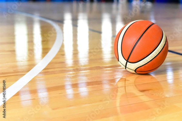 Fototapeta Basketball ball on Court Floor close up with blurred background
