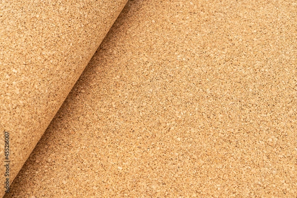Fototapeta Roll of natural cork used as underlay in flooring. Natural materials in construction.