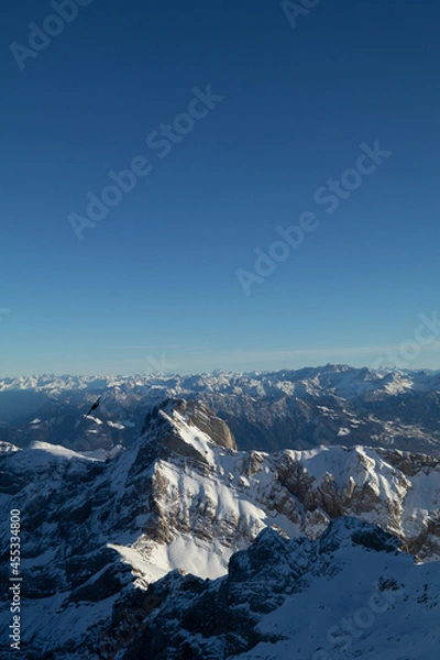 Fototapeta Amazing sunset at the top of one of the most impressive mountain in Switzerland called Säntis. Epic view over several cantons in Switzerland. Flying birds in front of the lens.