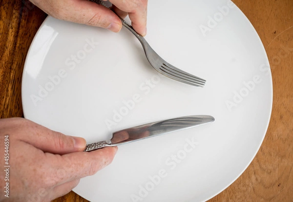 Obraz Dinner plate with knife and fork 