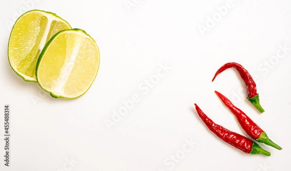 Obraz Lime and Chilli Peppers on White Background