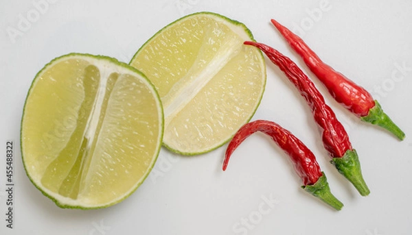 Obraz Lime and Chilli Peppers on white background
