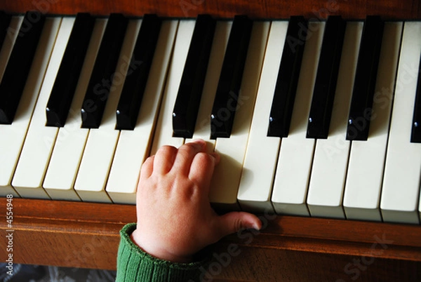 Obraz Small hand on piano