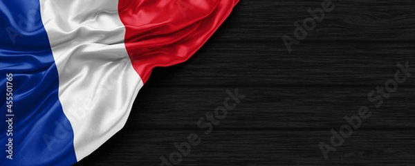 Obraz Close Up of France flag on the black wooden background 3D render