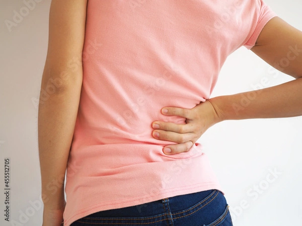 Obraz Asian woman showing back pain on a white background. medical concept.
