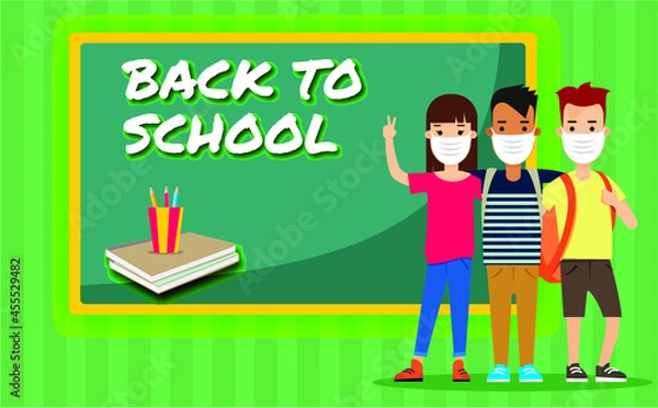 Obraz Social distancing at school after pandemic. Back to school concept after epidemic. Kids wearing face masks and maintaining safe distance. New normal scene for children.