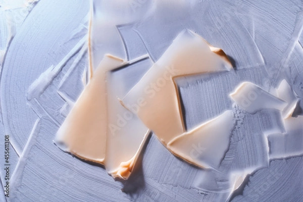 Fototapeta Close-up. The decorative texture of the cream, blue and beige, is an artistic brushstroke. Curly lines. High quality photo